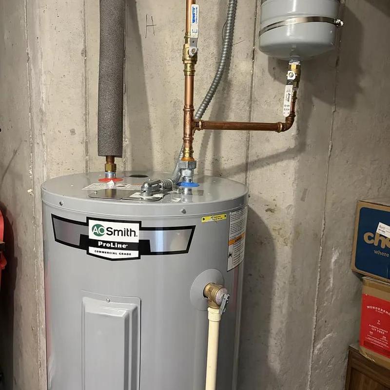 Water heater with expansion tank installed in basement