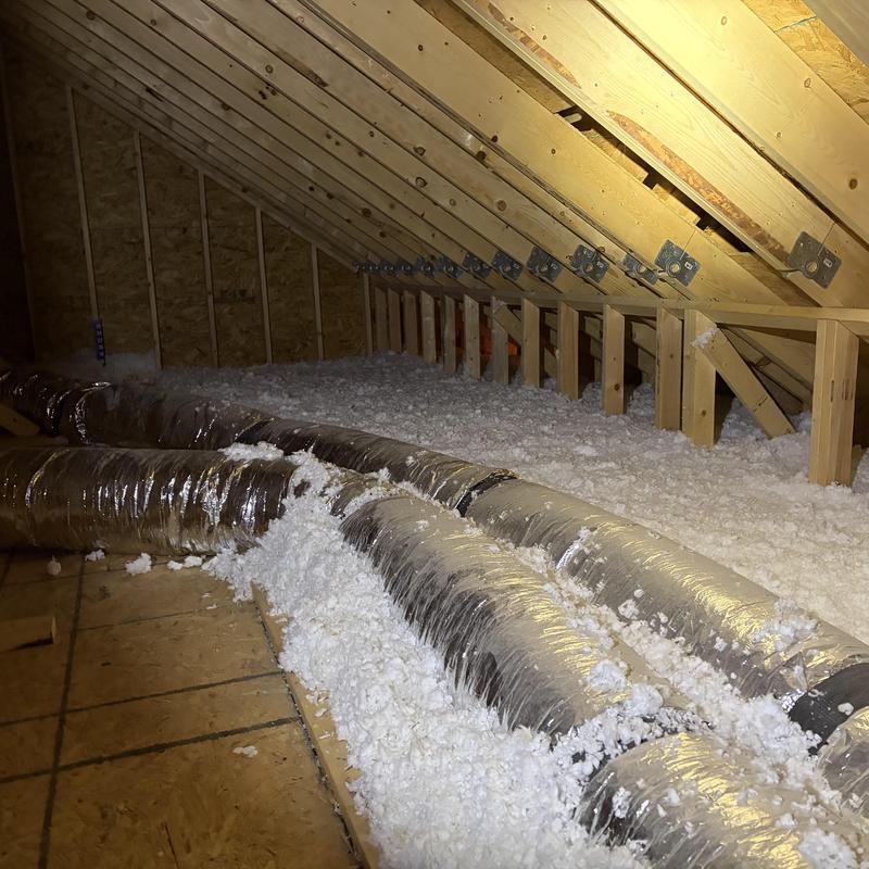 Attic loose fill insulation with ductwork in attic space