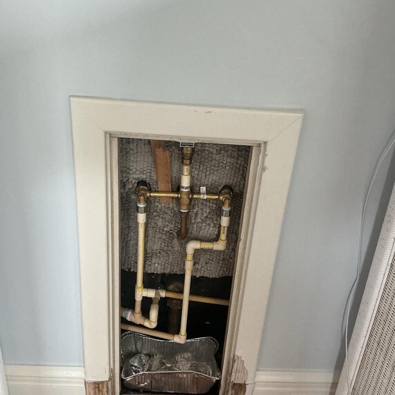 Shower mixing valve plumbing with piping removed Shower mixing valve plumbing with piping removed