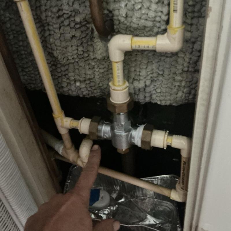 Shower mixing valve removed for leak inspection Shower mixing valve removed for leak inspection
