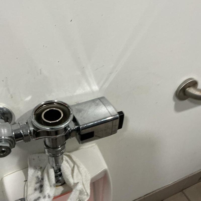 Sloan urinal flushometer without handle in restroom Sloan urinal flushometer without handle in restroom