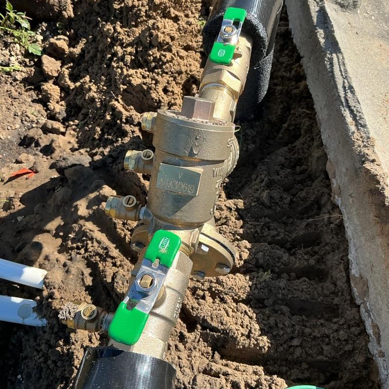 1-inch brass backflow preventer with green valves installation 1-inch brass backflow preventer with green valves installation