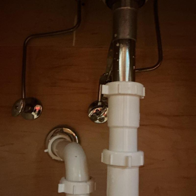 Bathroom sink drain trap and supply lines under cabinet Bathroom sink drain trap and supply lines under cabinet