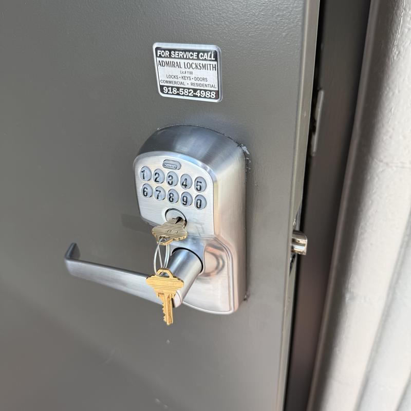 Schlage keypad lock with keys on metal door Schlage keypad lock with keys on metal door