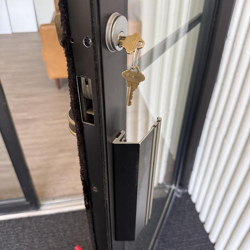 Door lock with keys inserted and metal handle Door lock with keys inserted and metal handle