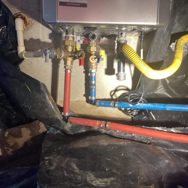 Tankless water heater plumbing and vent connections Tankless water heater plumbing and vent connections