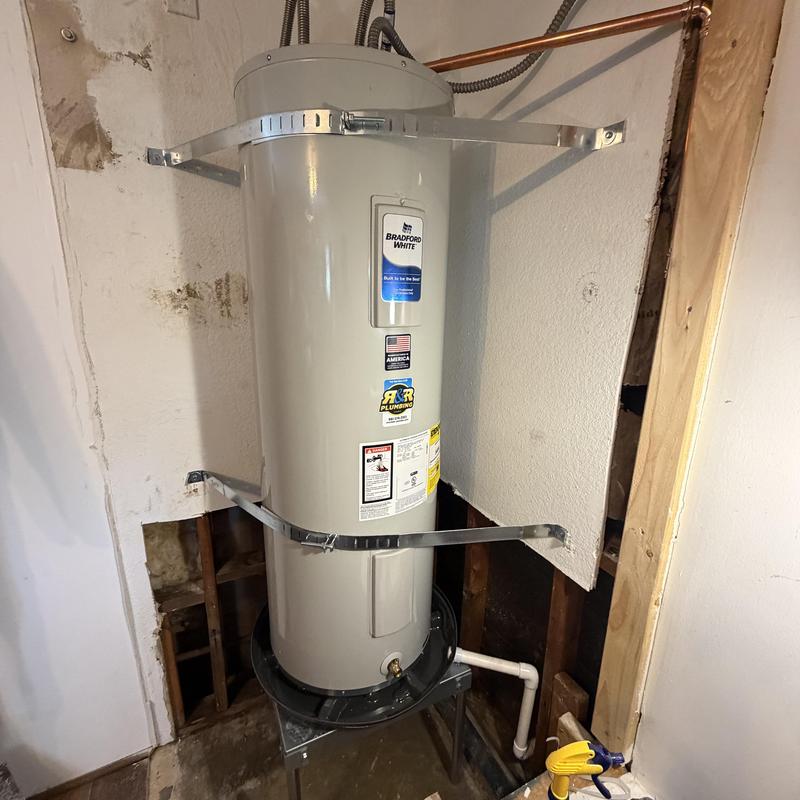 Electric water heater installation with seismic straps