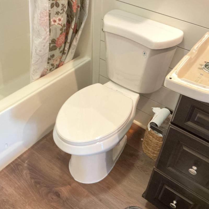 Toilet installation with new wax ring and closet bolts