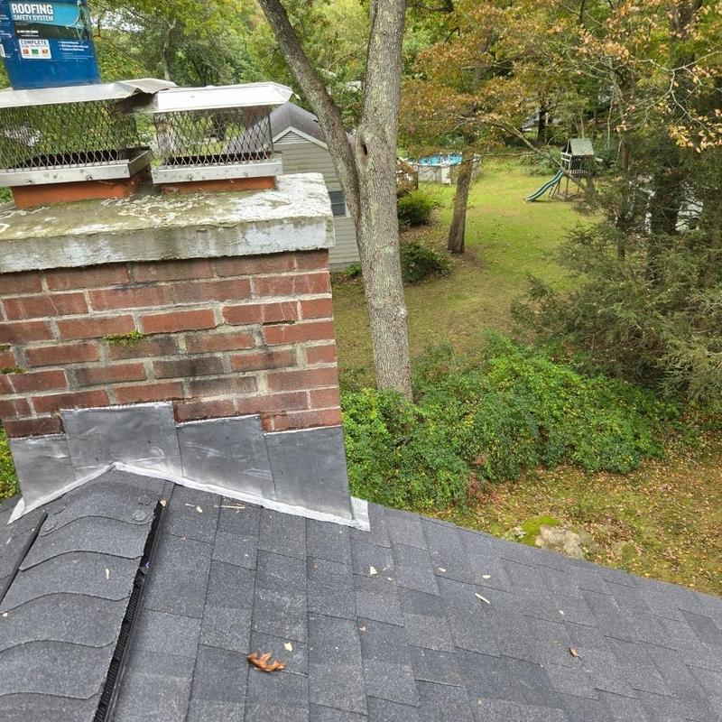 Chimney flashing repair on shingled roof