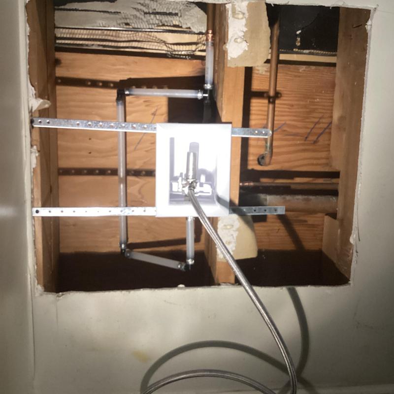 Ice maker box and plumbing behind wall in kitchen Ice maker box and plumbing behind wall in kitchen
