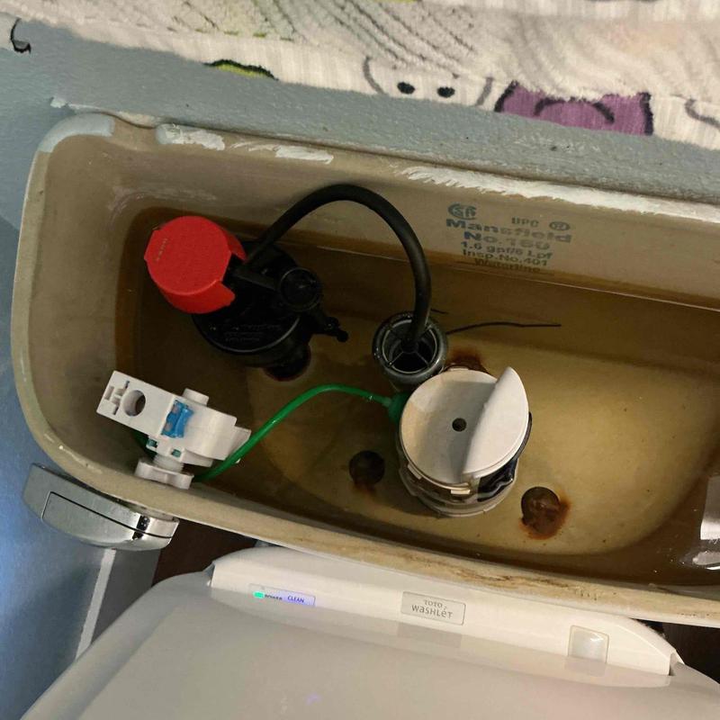 Toilet fill valve and flush valve inside tank