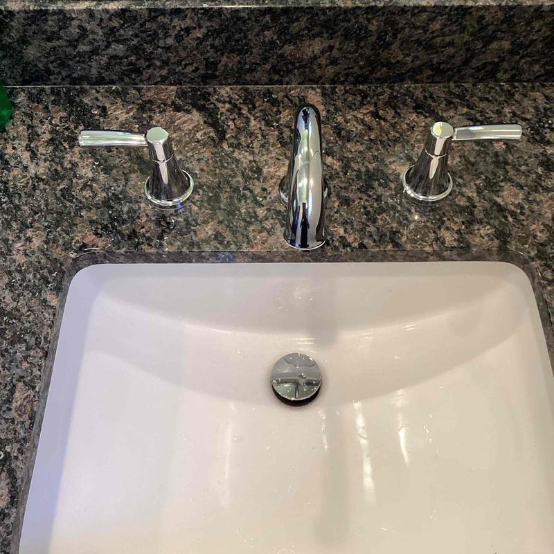 Widespread faucet and pop-up drain assembly on granite