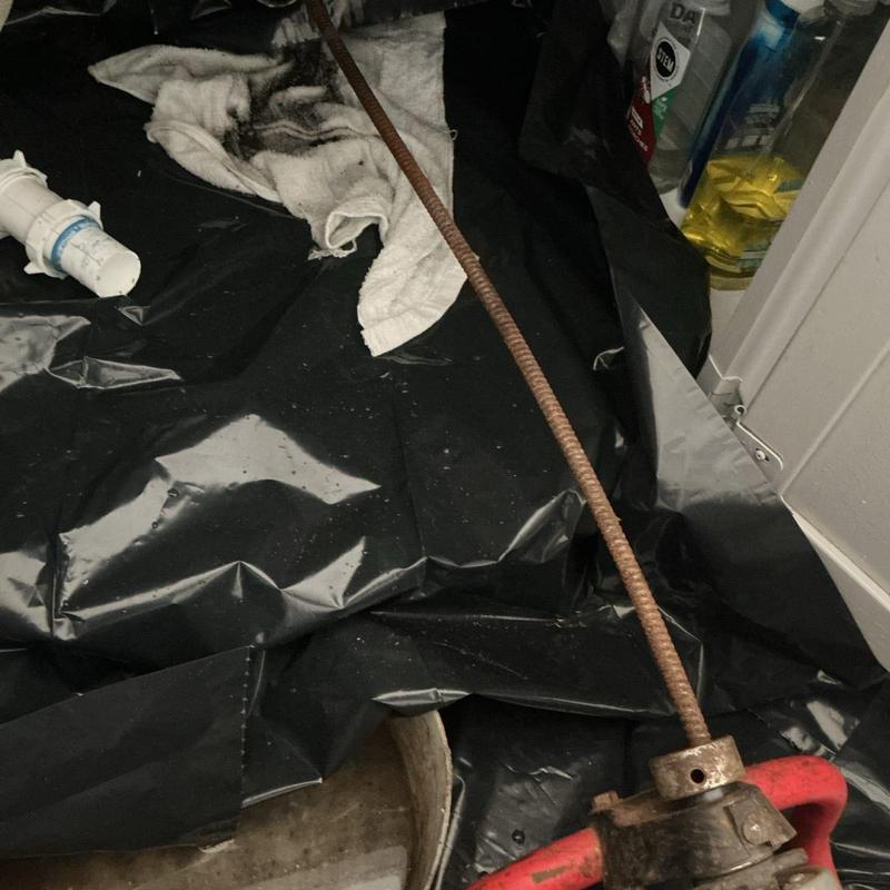 Kitchen drain line snake clearing blockage and debris