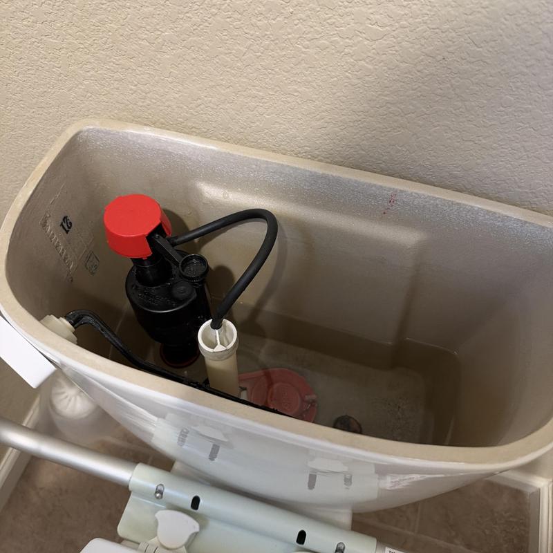 Toilet tank fill valve and flush mechanism inside tank