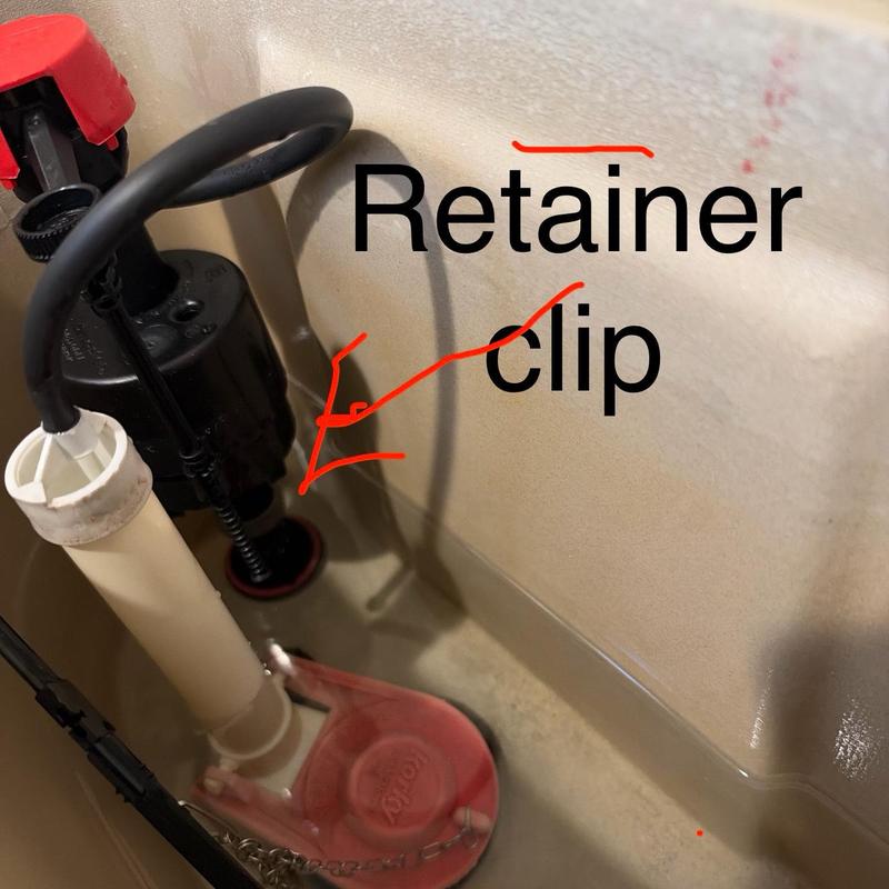 Toilet fill valve retainer clip inside tank