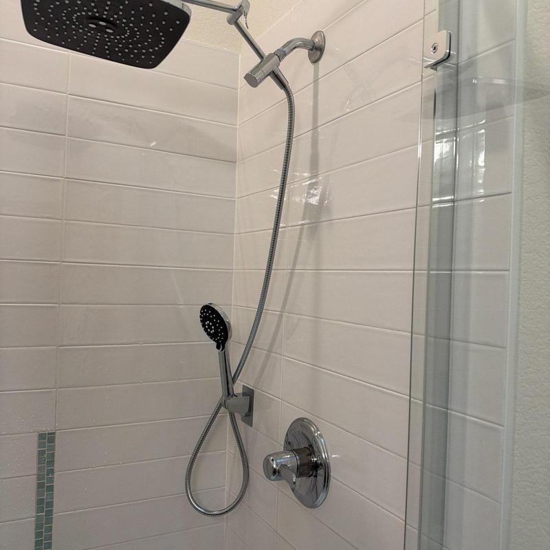 Shower system with rain and handheld shower heads