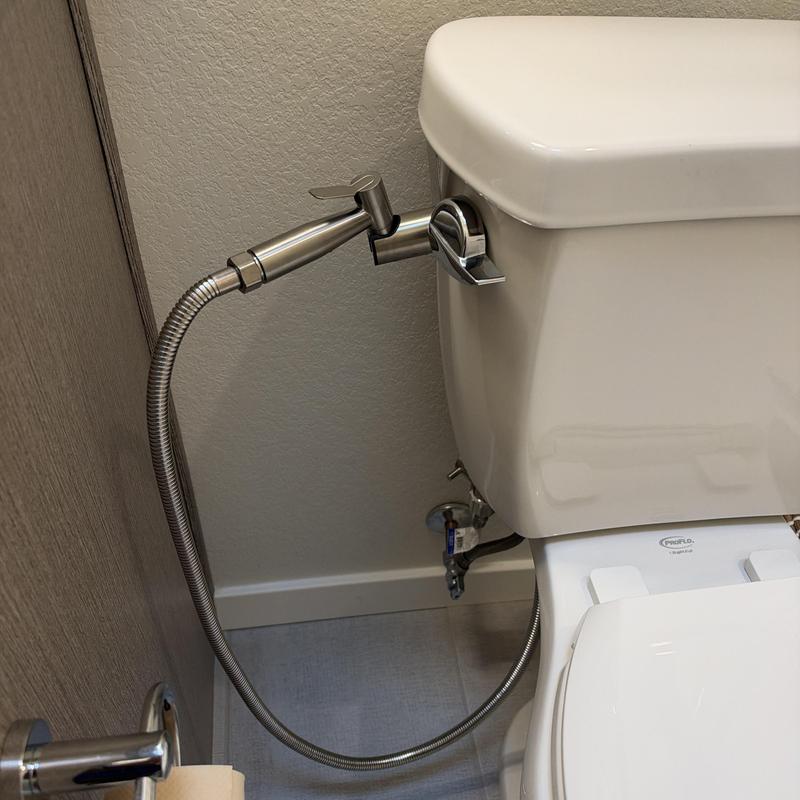 Bidet attachment and supply line on toilet tank