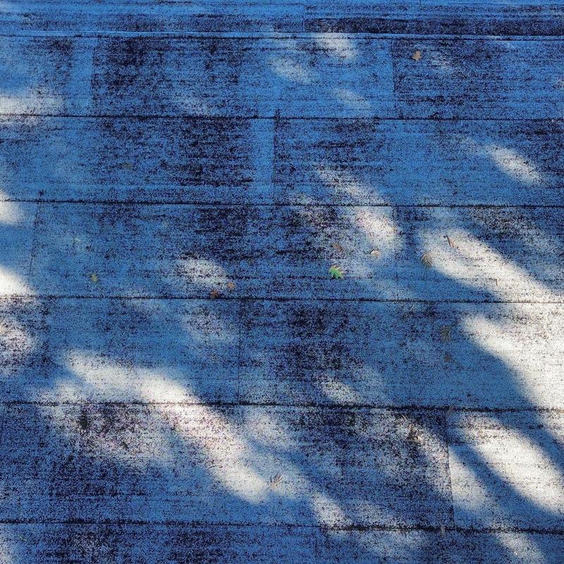 EPDM rubber roof with debris and wear marks EPDM rubber roof with debris and wear marks