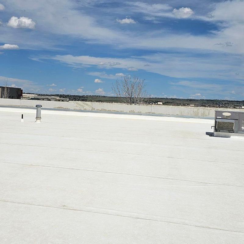 TPO flat roof with vents and HVAC unit
