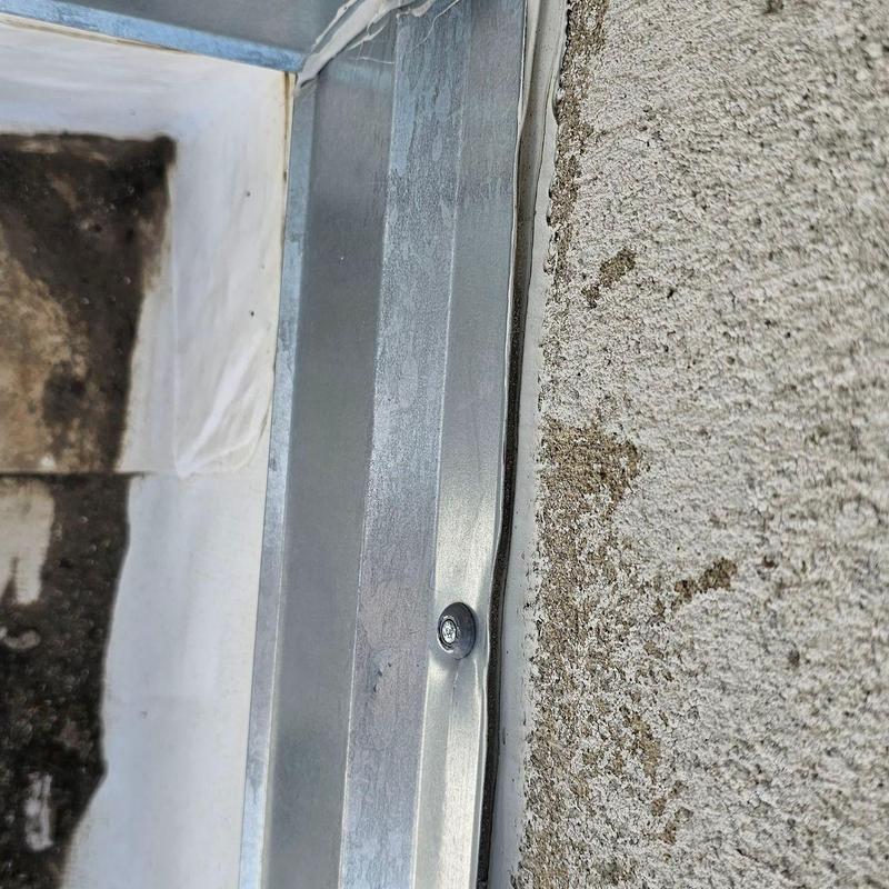 TPO flat roof wall flashing with fastener and sealant