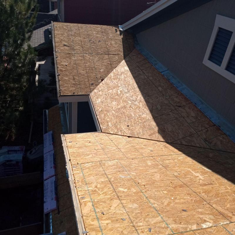 Oriented strand board roof decking installation on house roof