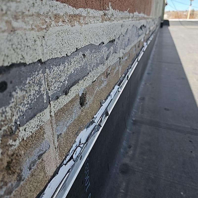EPDM roof wall flashing with deteriorated sealant EPDM roof wall flashing with deteriorated sealant