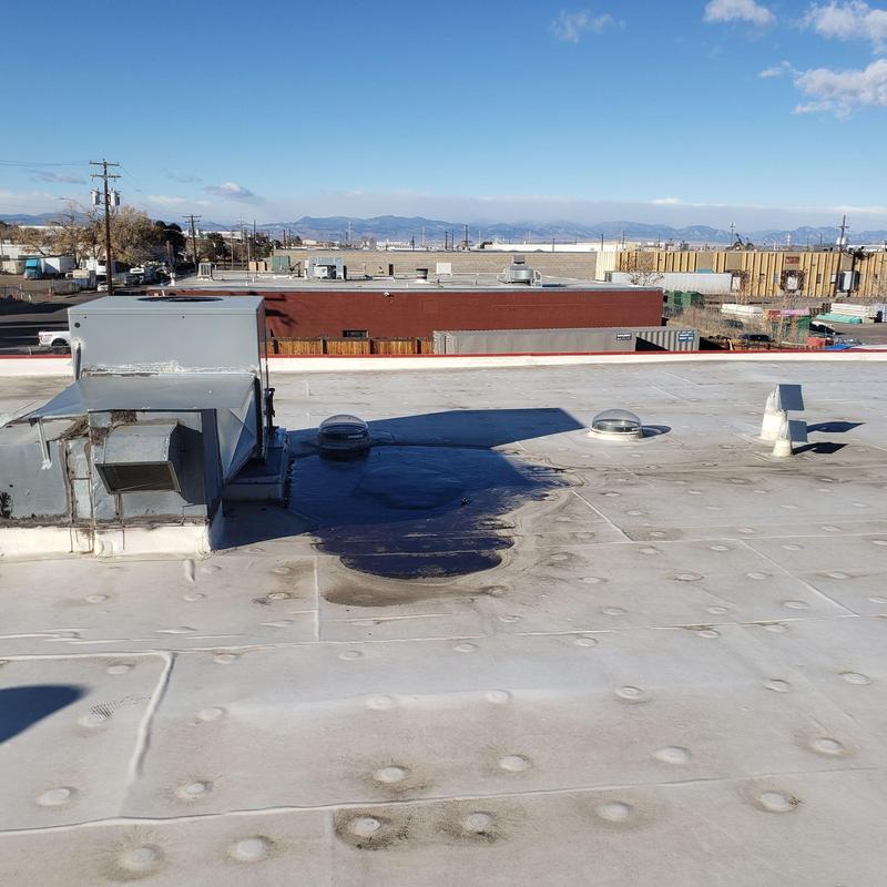 TPO flat roof with HVAC unit and pipe jacks TPO flat roof with HVAC unit and pipe jacks