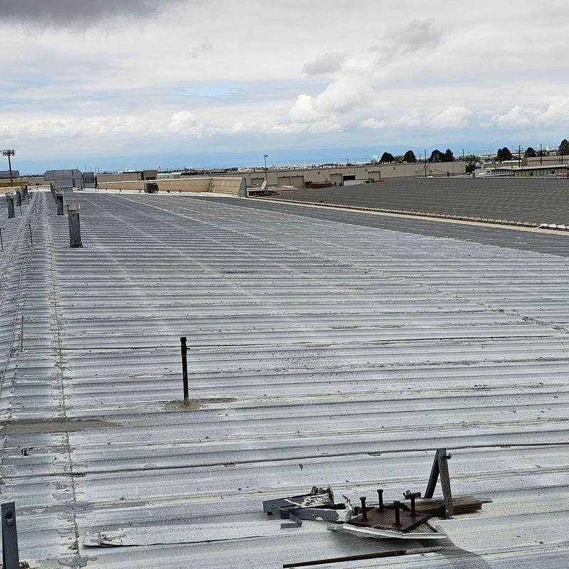 Metal roof with seam separation and exposed screws Metal roof with seam separation and exposed screws