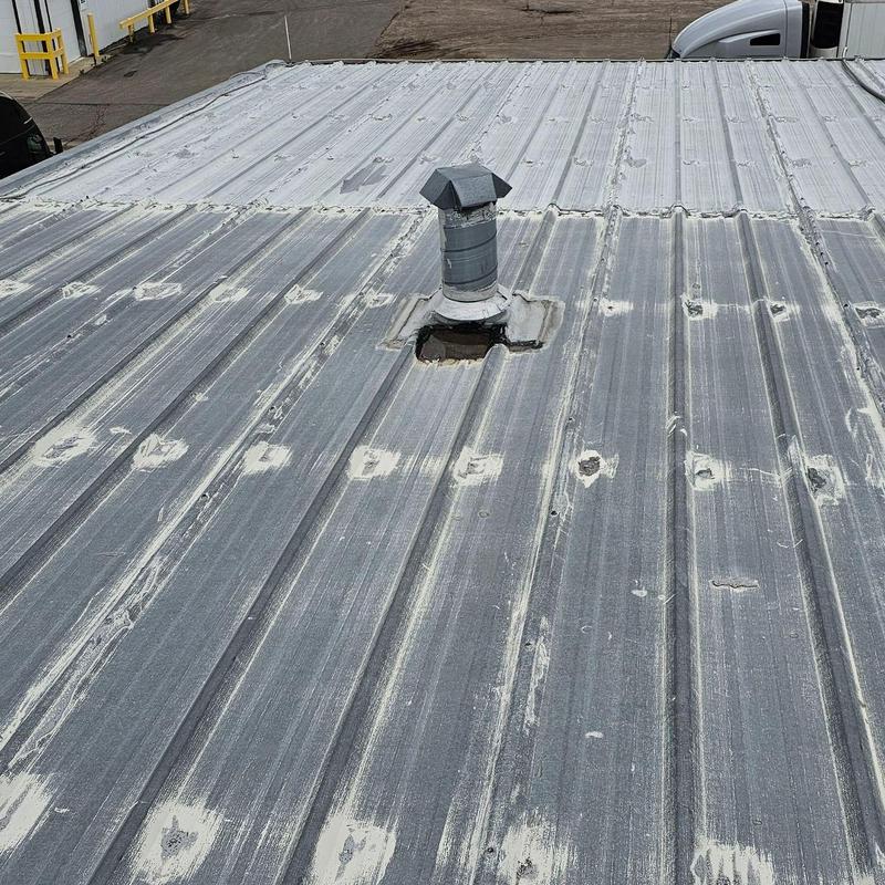 Metal roof with seam separation and exposed screws Metal roof with seam separation and exposed screws