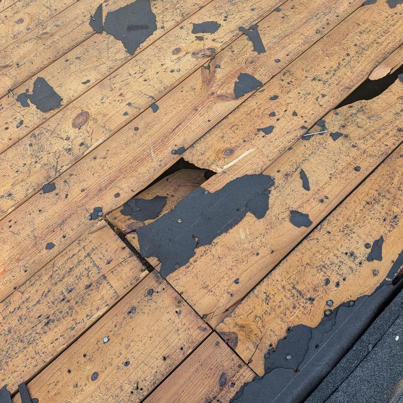 Roof decking with weathered underlayment and damage