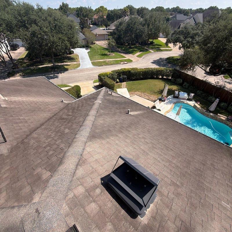 Roof shingles and vent cap with backyard pool view Roof shingles and vent cap with backyard pool view