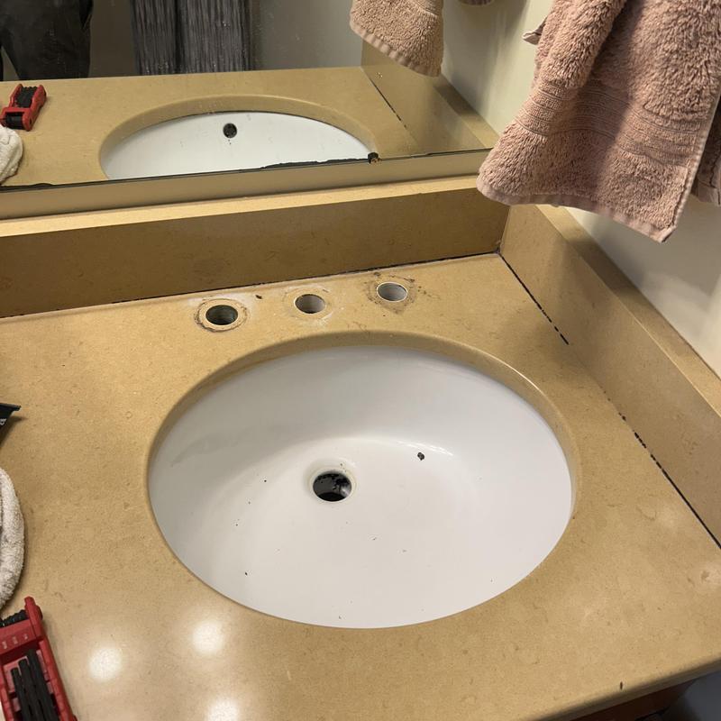 Bathroom sink faucet holes without fixtures installed Bathroom sink faucet holes without fixtures installed