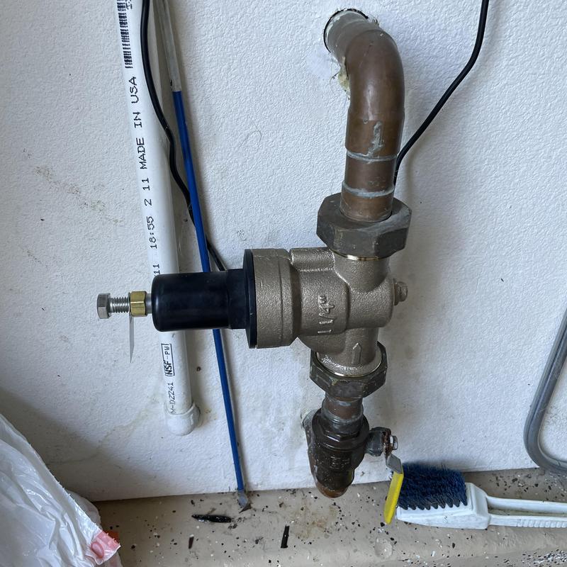 Watts 1.25 pressure regulator installed on pipe