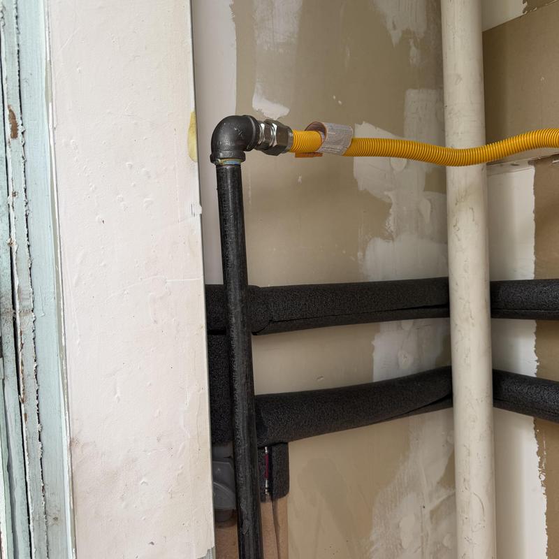 Gas line and insulated water pipes retrofit installation Gas line and insulated water pipes retrofit installation
