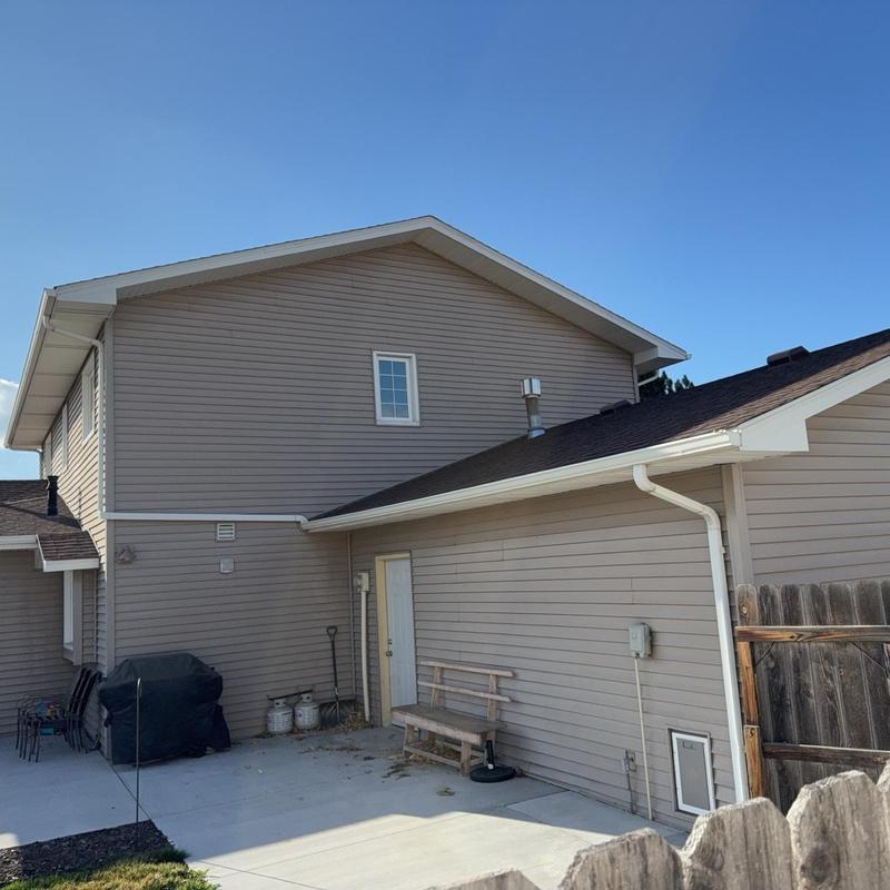 Gutters and downspouts on residential house exterior Gutters and downspouts on residential house exterior