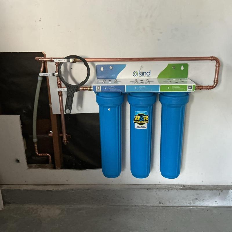 Three-canister whole-house water filtration system installation