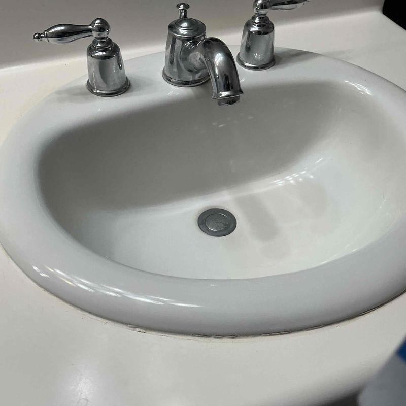Bathroom sink faucet and drain assembly with handles