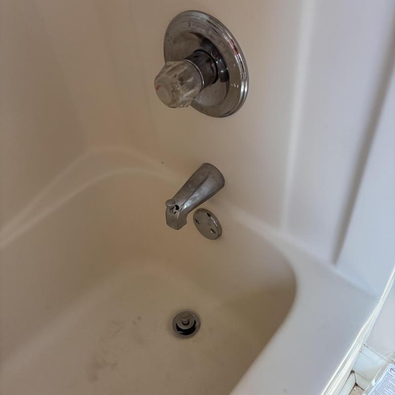 Tub spout and overflow valve installation in bathtub Tub spout and overflow valve installation in bathtub