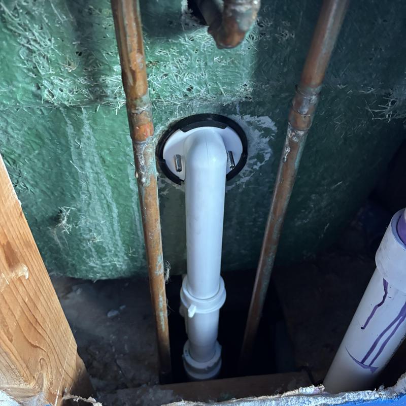 Tub shoe and overflow pipe installation behind wall Tub shoe and overflow pipe installation behind wall