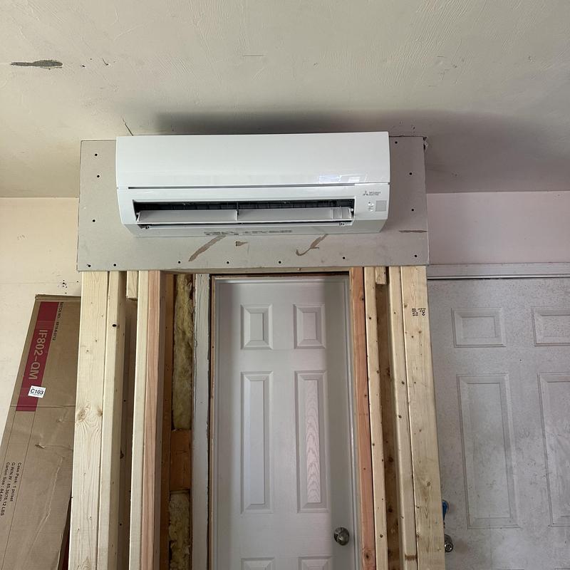 Mini split air conditioner installed above interior door Mini split air conditioner installed above interior door