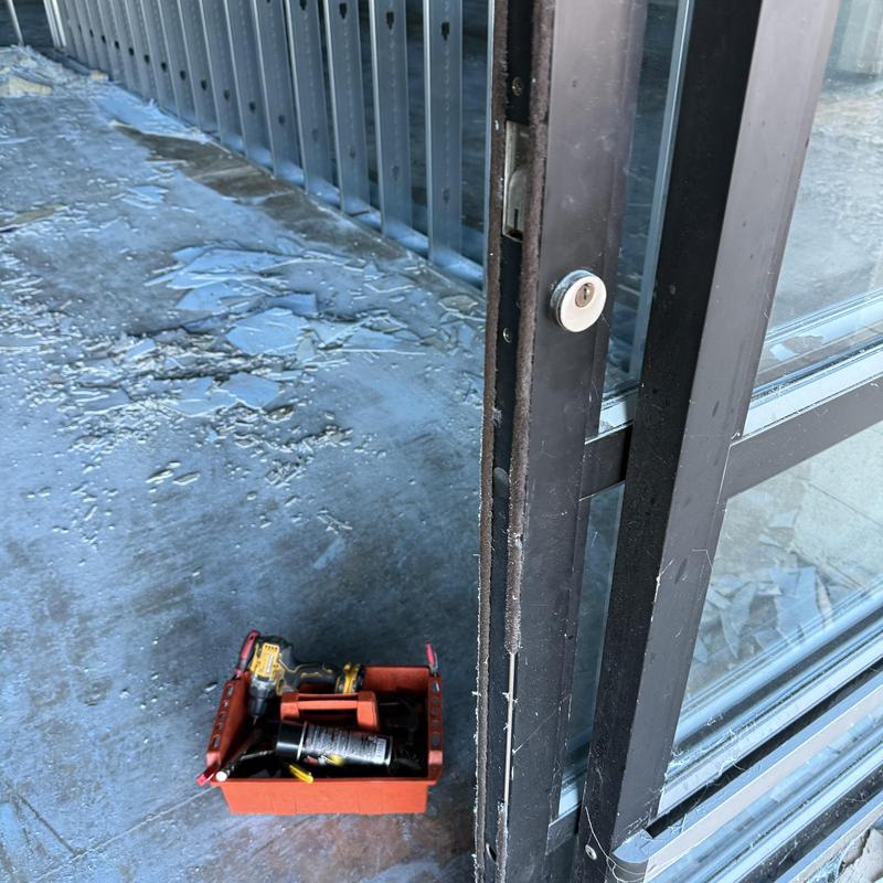 Door lock cylinder and frame prepping with tools nearby Door lock cylinder and frame prepping with tools nearby