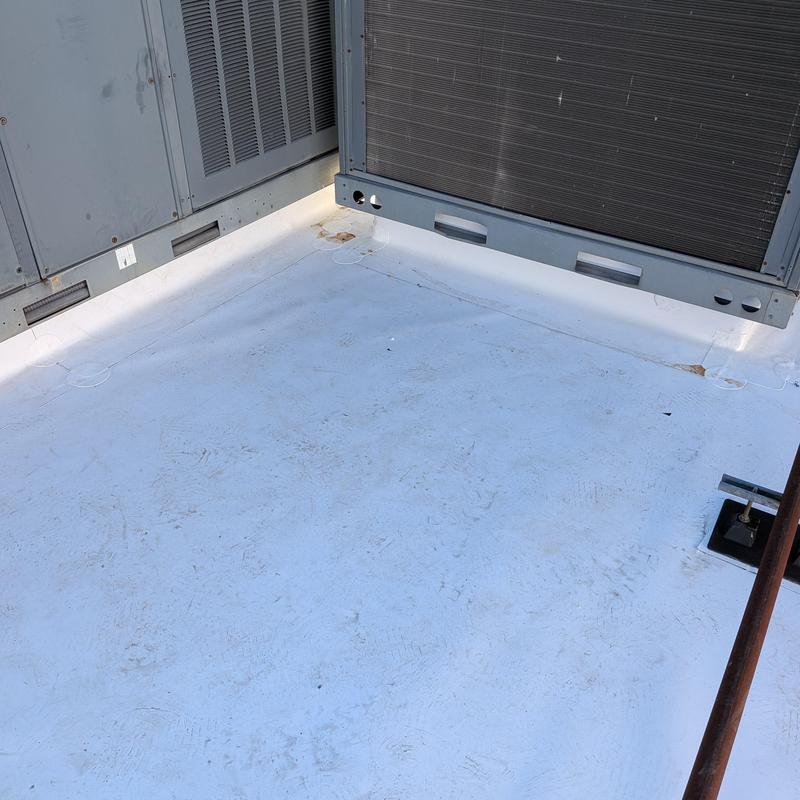 Commercial flat roofing membrane near HVAC units