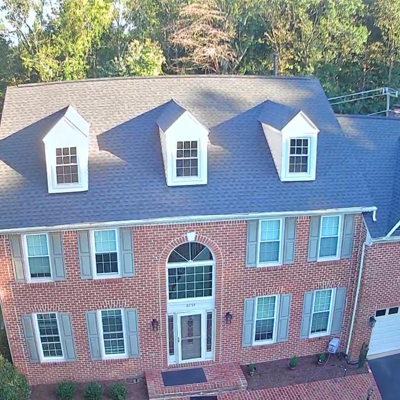 Architectural shingle roof with new gutters and downspouts Architectural shingle roof with new gutters and downspouts