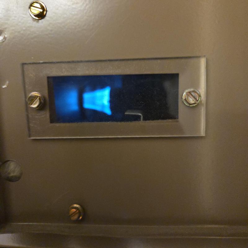 Furnace burner flame through viewing window Furnace burner flame through viewing window