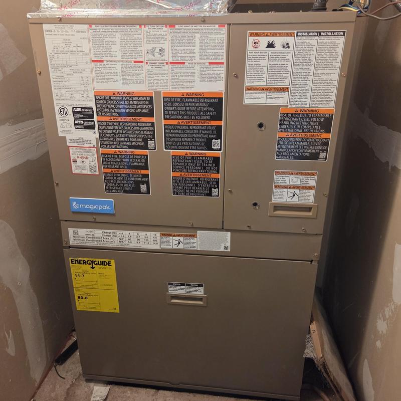 Packaged HVAC unit with warning labels and energy guide Packaged HVAC unit with warning labels and energy guide
