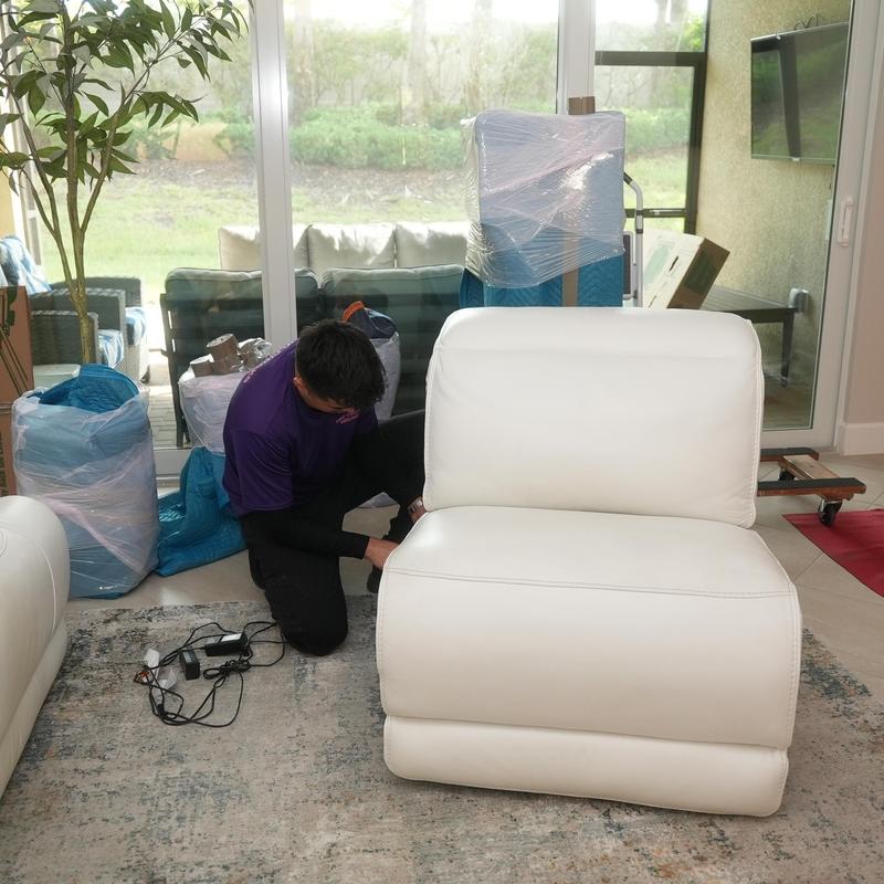 White leather chair packing in living room for move