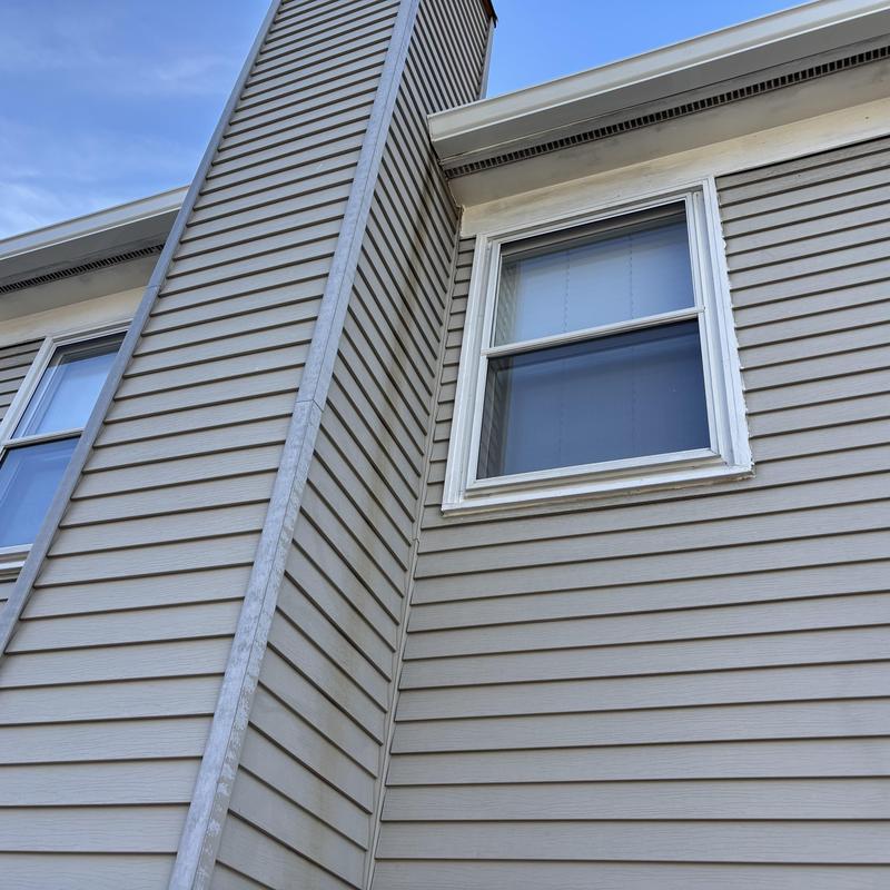 Vinyl siding and window exterior on residential home Vinyl siding and window exterior on residential home