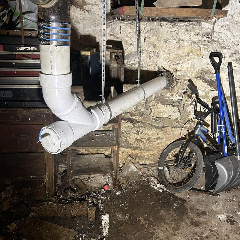 Back pitched sewer main with new PVC cleanout Back pitched sewer main with new PVC cleanout
