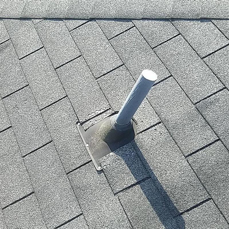 Shingle roof vent pipe flashing with storm damage repair