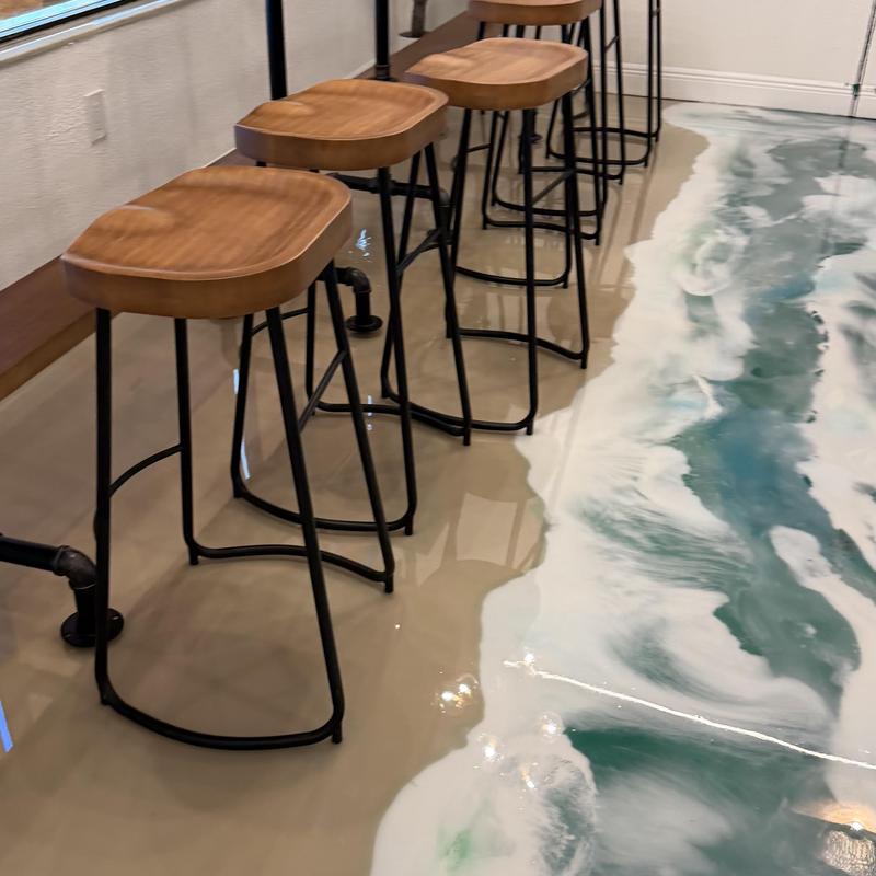 Ocean-themed epoxy floor with bar stools
